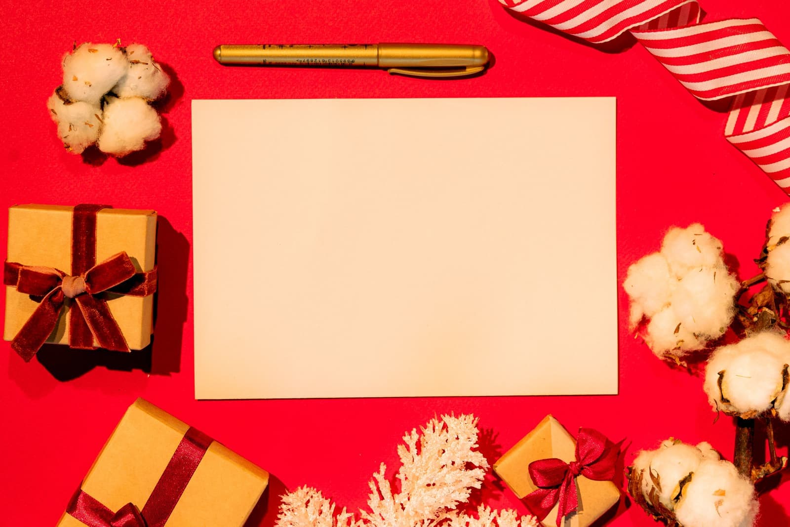 A boxed notebook and pen gift set tied with ribbon