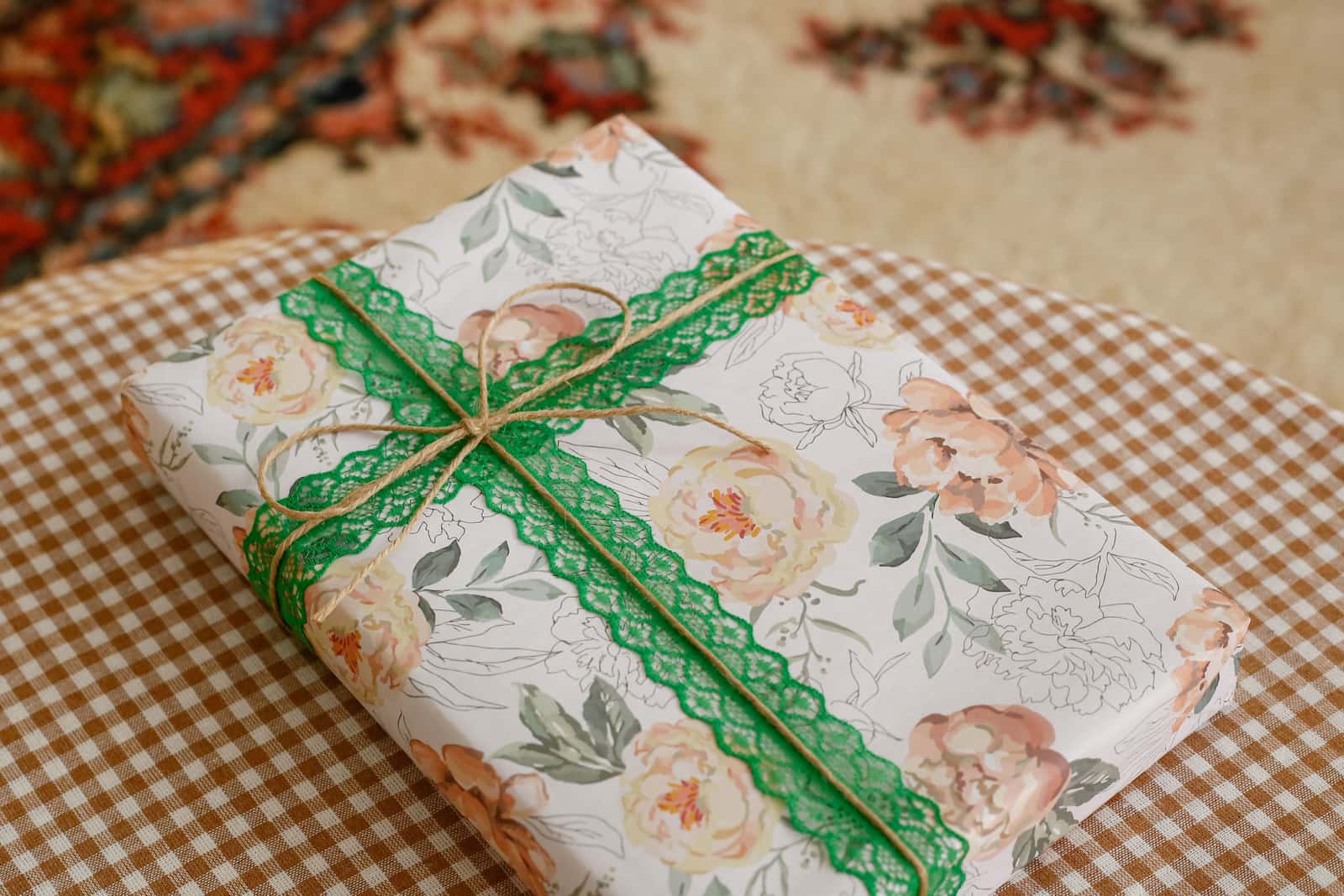 A journal wrapped as a gift with ribbon on a table