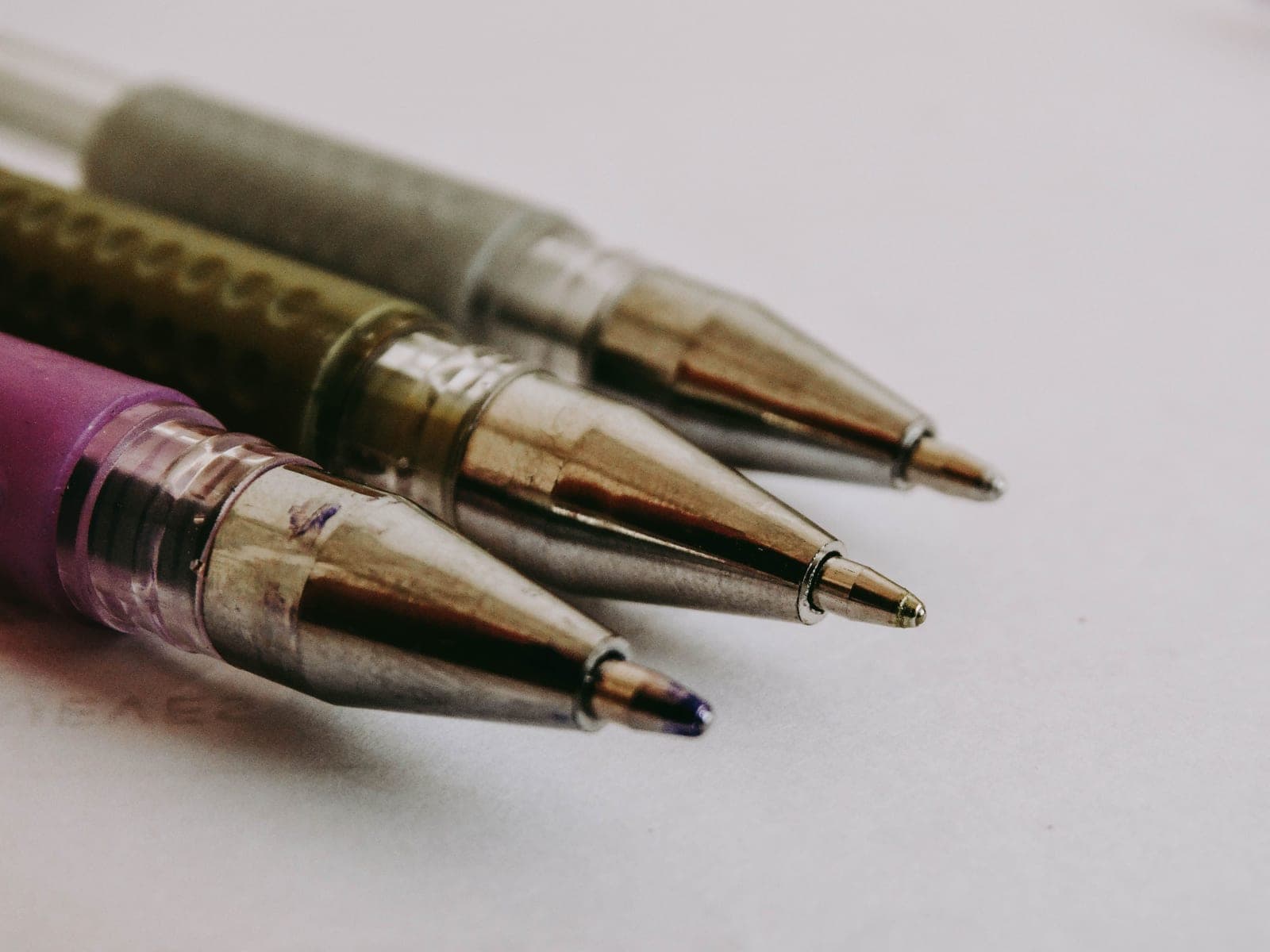 Ballpoint pens photographed close up on a notepad